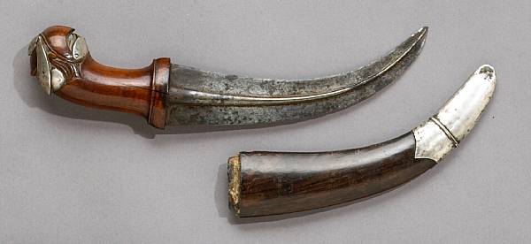 Appraisal: A silver-mounted southeast Asian dagger th century Sharply curved inch