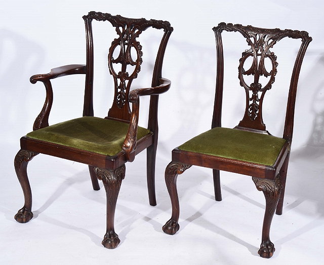 Appraisal: A SET OF EIGHT CHIPPENDALE STYLE MAHOGANY DINING CHAIRS consisting