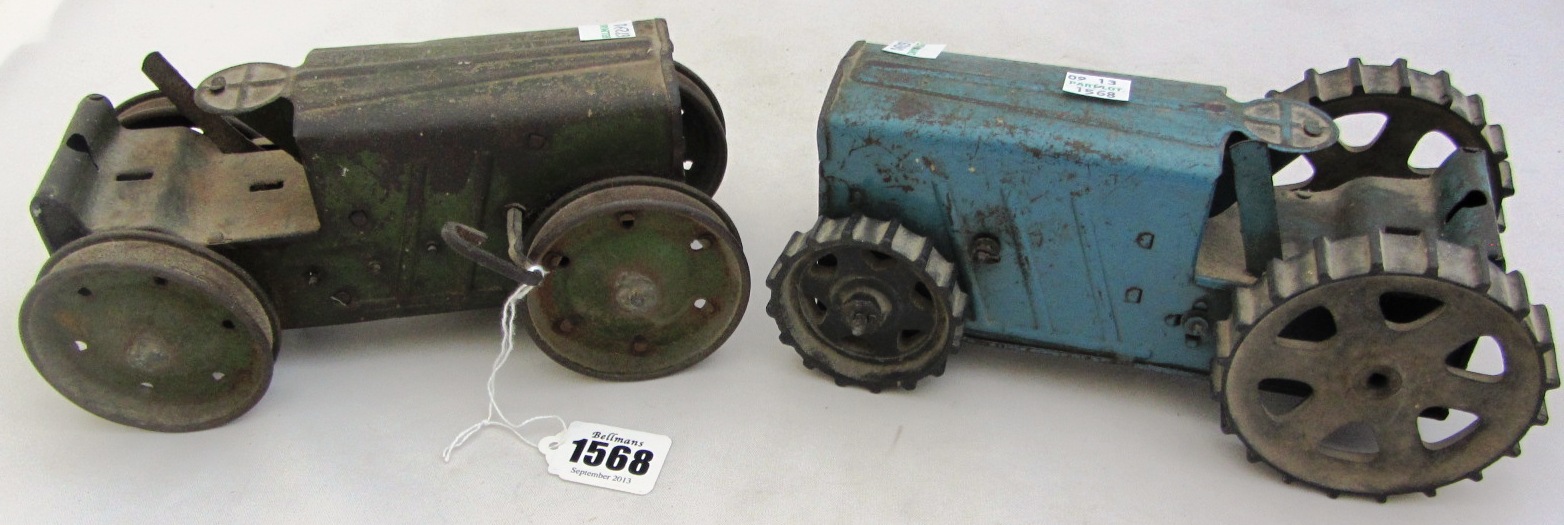 Appraisal: A Triang tinplate tractor and a similar green version