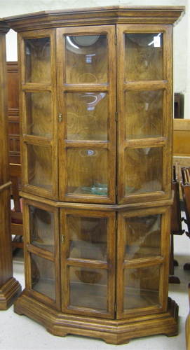 Appraisal: PECAN AND GLASS CURIO CABINET-ON-CABINET American modern The top and