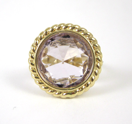 Appraisal: AMETHYST AND FOURTEEN KARAT GOLD RING set with an oval-cut