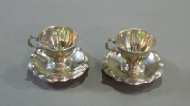 Appraisal: A pair of silver tea cups and saucers