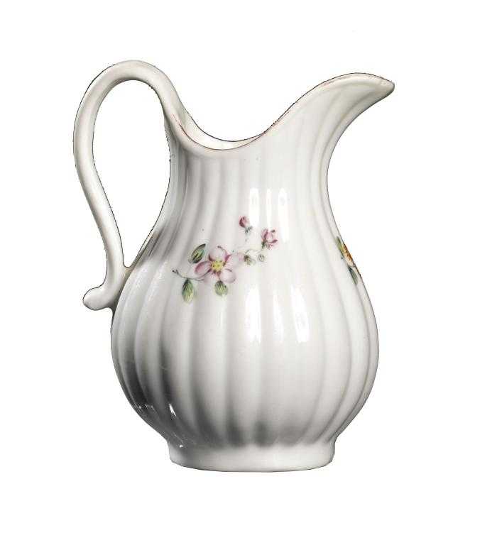 Appraisal: A DERBY REEDED CREAM JUG of baluster shape enamelled with