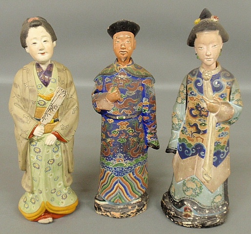 Appraisal: - Three Chinese terracotta figures th c with nodding heads