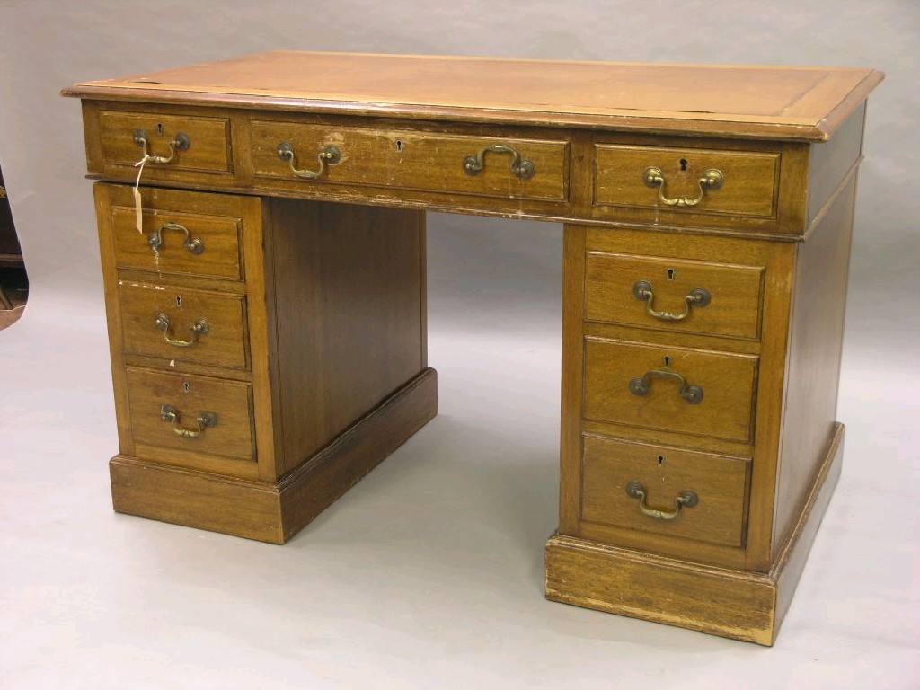 Appraisal: A mahogany pedestal desk top with inset vinyl and three