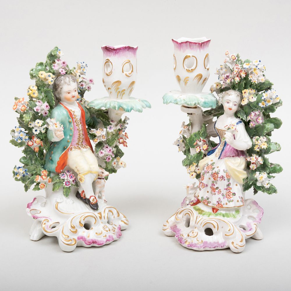 Appraisal: Pair of Derby Porcelain Bocage Figural Candlesticks in high Condition