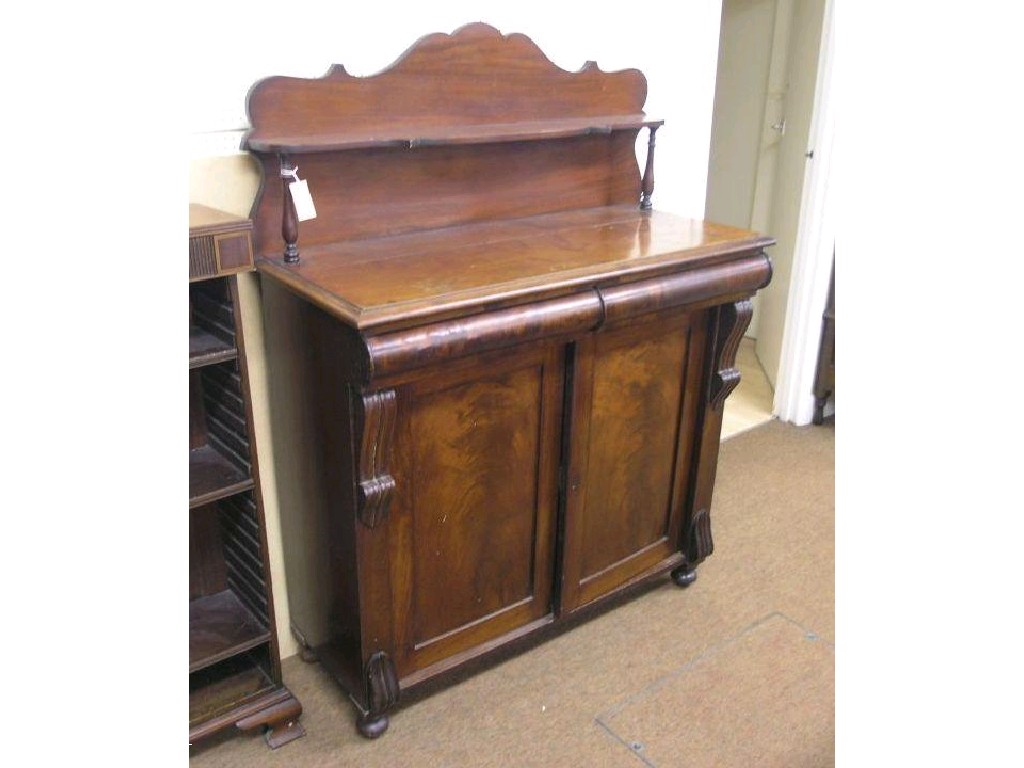 Appraisal: An early th century mahogany veneered chiffonier over-shelf raised upon