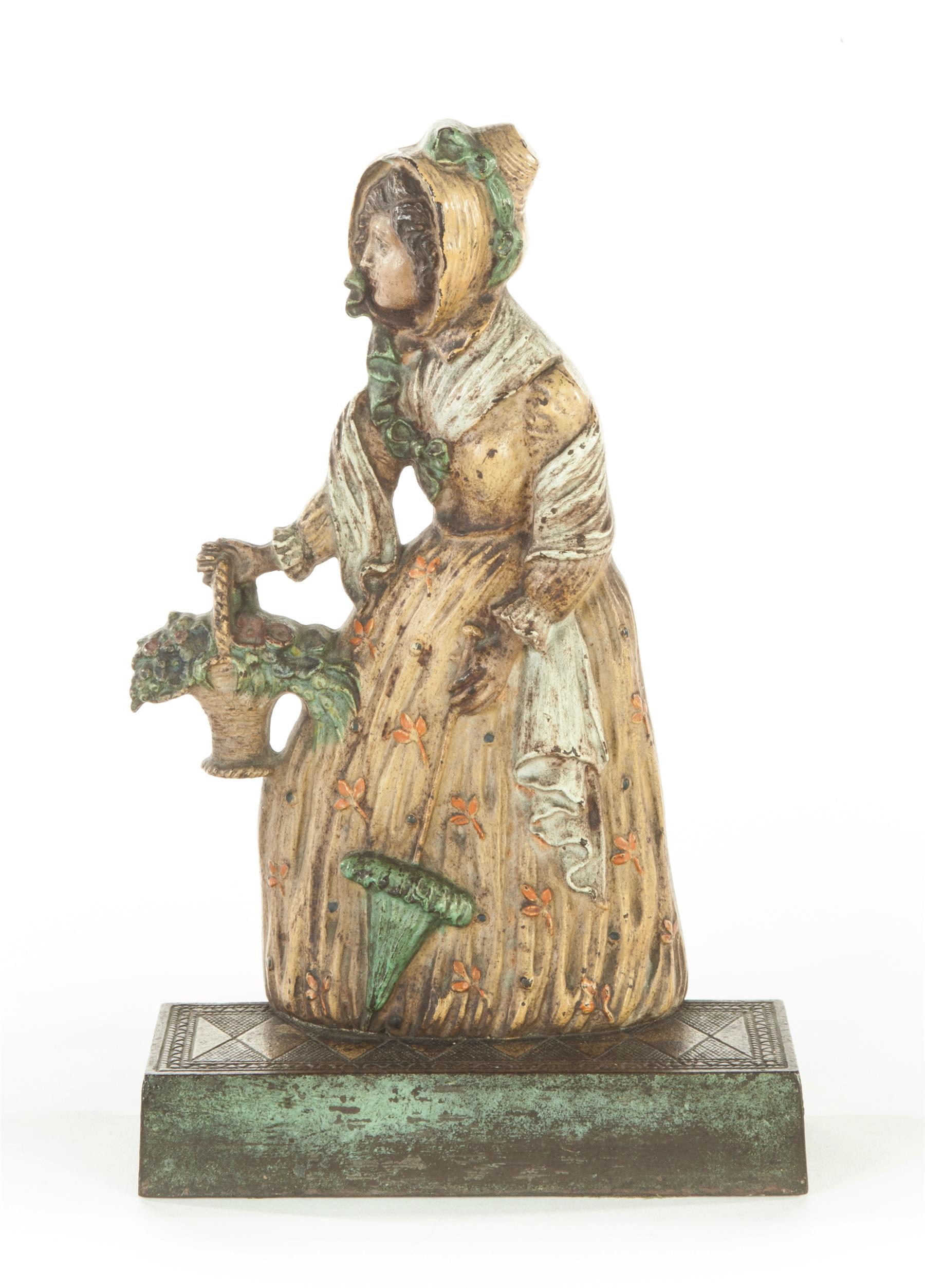 Appraisal: BRADLEY HUBBARD CAST IRON DOORSTOP Early th century Victorian woman