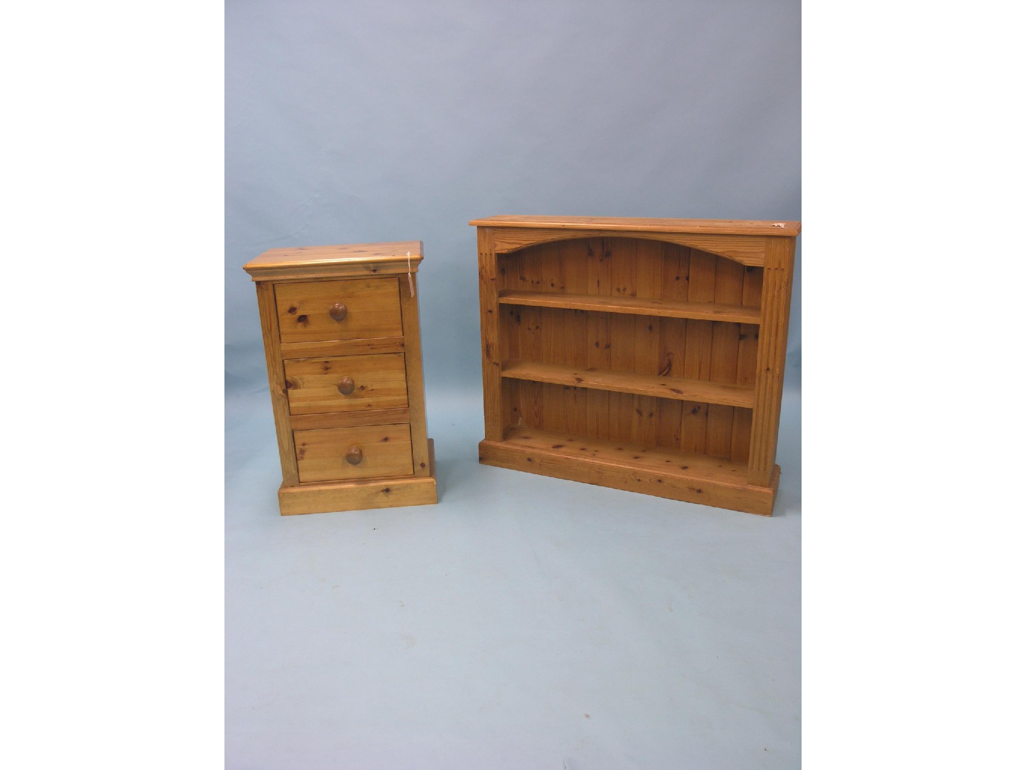 Appraisal: A waxed pine open bookcase two fitted shelves ft in