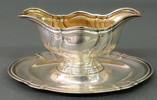 Appraisal: One-piece sterling silver gravy boat and liner marked A Wiehmeyer