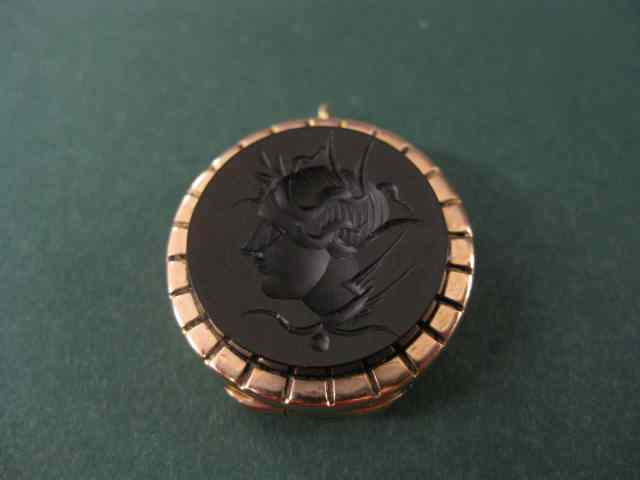 Appraisal: Victorian k Locket with Intagliocut black onyx bust of a