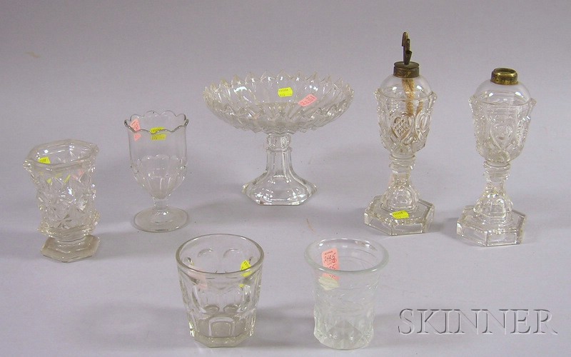 Appraisal: Seven Colorless Pressed Pattern Glass Table Items a pair of