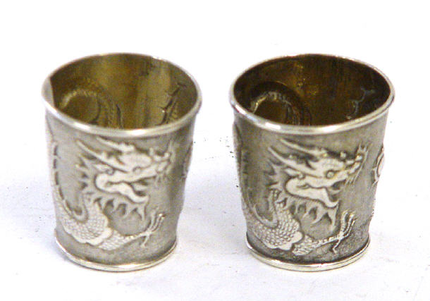 Appraisal: Pair of Chinese silver tapering tots embossed with dragons marks