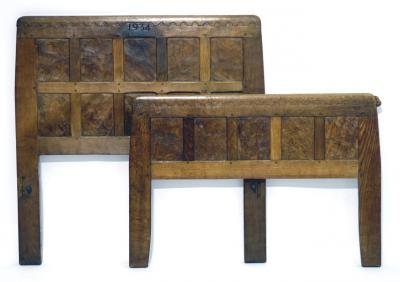 Appraisal: AN ADZED OAK BEDSTEAD by Robert Mouseman Thompson the burr