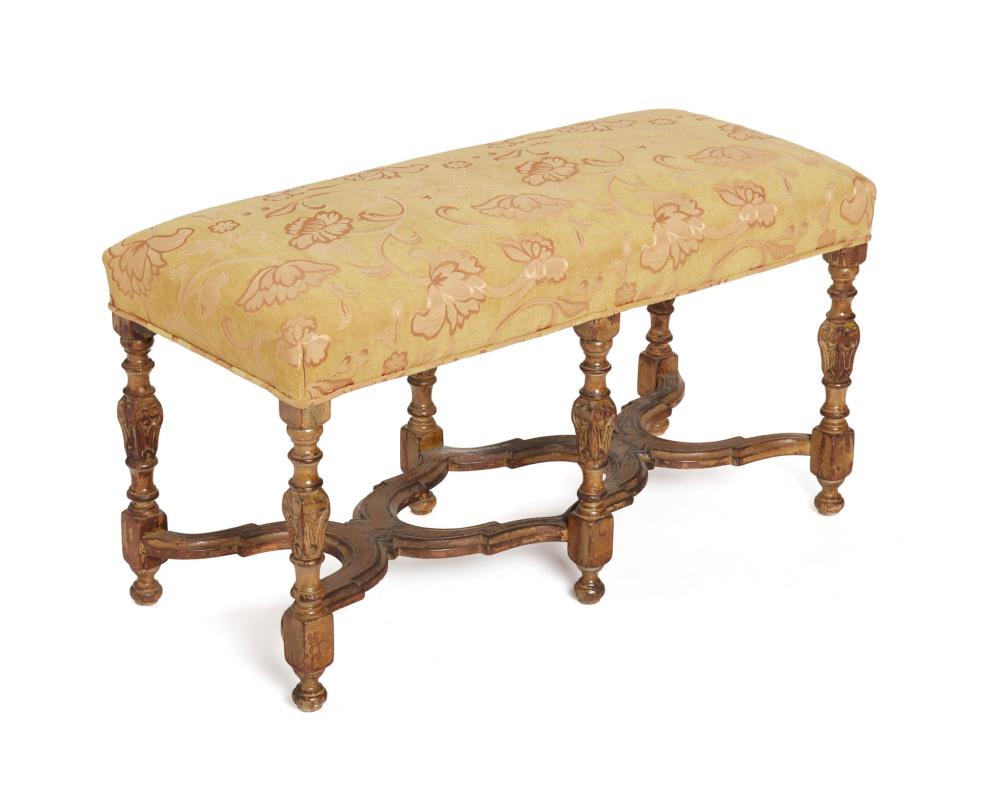 Appraisal: A carved wood bench th Century With gold floral upholstery