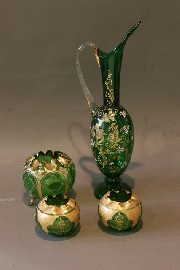 Appraisal: A large ewer three vases in green glass with applied