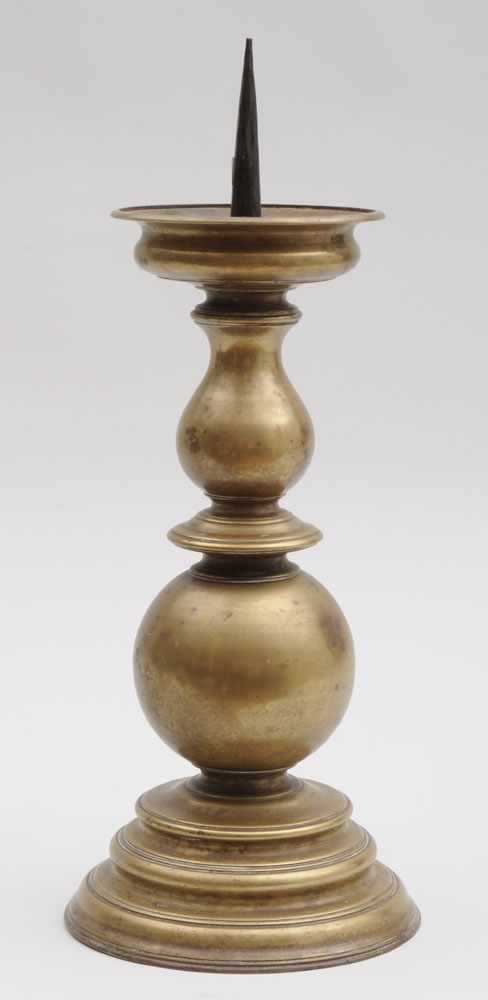 Appraisal: CONTINENTAL BAROQUE BRASS PRICKET STICK The vase and orb stem