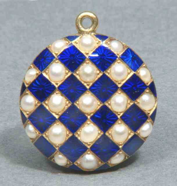 Appraisal: A PEARL AND ENAMEL CIRCULAR LOCKET of chequered form