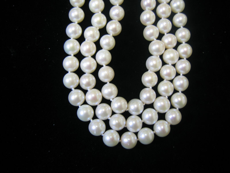 Appraisal: CULTURED PEARLS Triple strand mm pearls wit k yellow gold