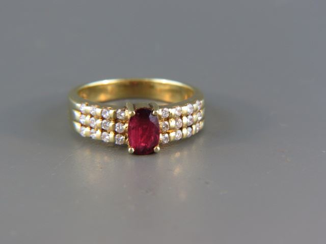 Appraisal: Ruby and Diamond Ring rich oval gem wieghing carat with