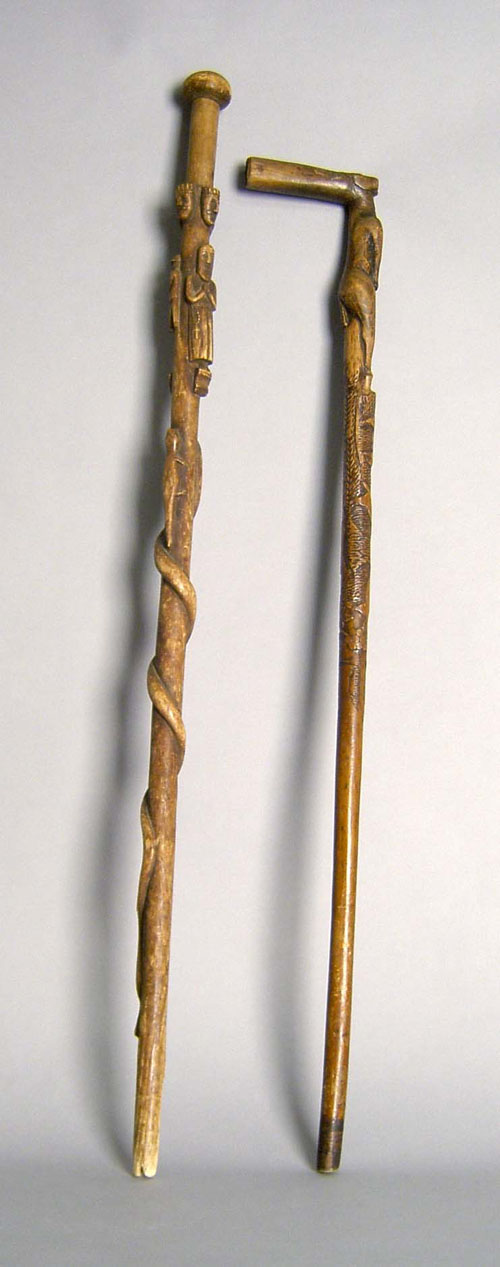 Appraisal: Two carved folk art canes