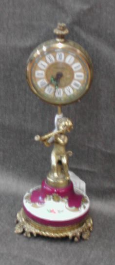 Appraisal: Diminutive West German Gilt-Brass-Mounted Porcelain Boudoir Clock featuring a putto