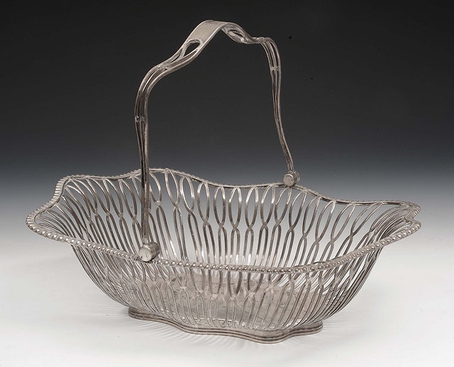 Appraisal: An open silver fruit basketof shaped rectangular form with swing