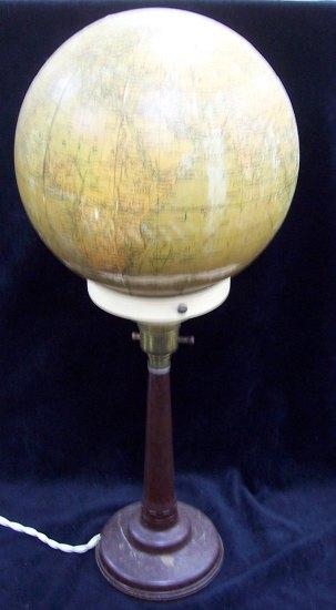 Appraisal: A Phillips British Empire globe lamp shade upon a bakelite