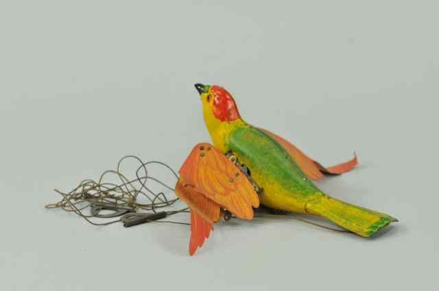 Appraisal: LEHMANN MECHANICAL FLYING BIRD Germany hand painted tin body done