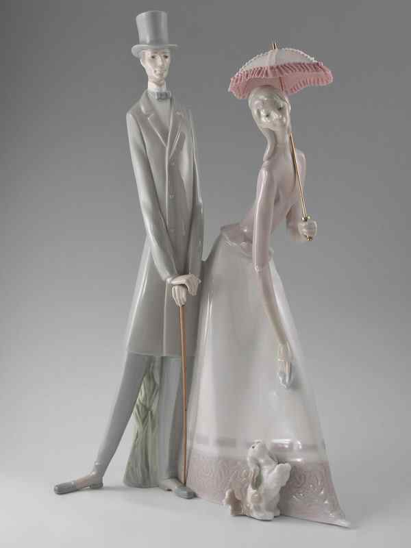 Appraisal: LLADRO PORCELAIN FIGURINE COUPLE WITH PARASOL Fulgencio Garcia sculptor issued