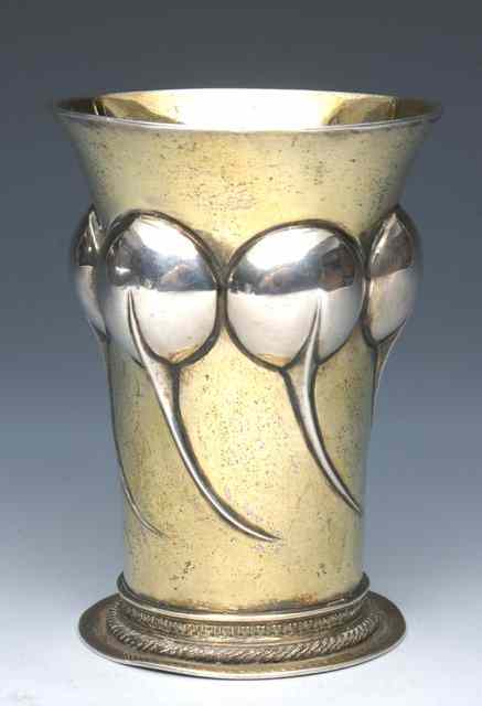 Appraisal: A CONTINENTAL SILVER GILT BEAKER with chased balloon style decoration