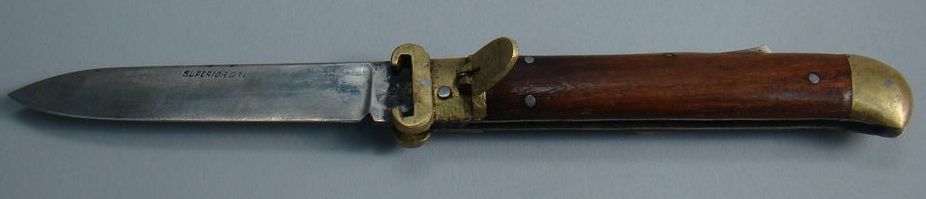 Appraisal: ENGLISH SWITCHBLADE Late th CenturyWith walnut and brass handle Blade