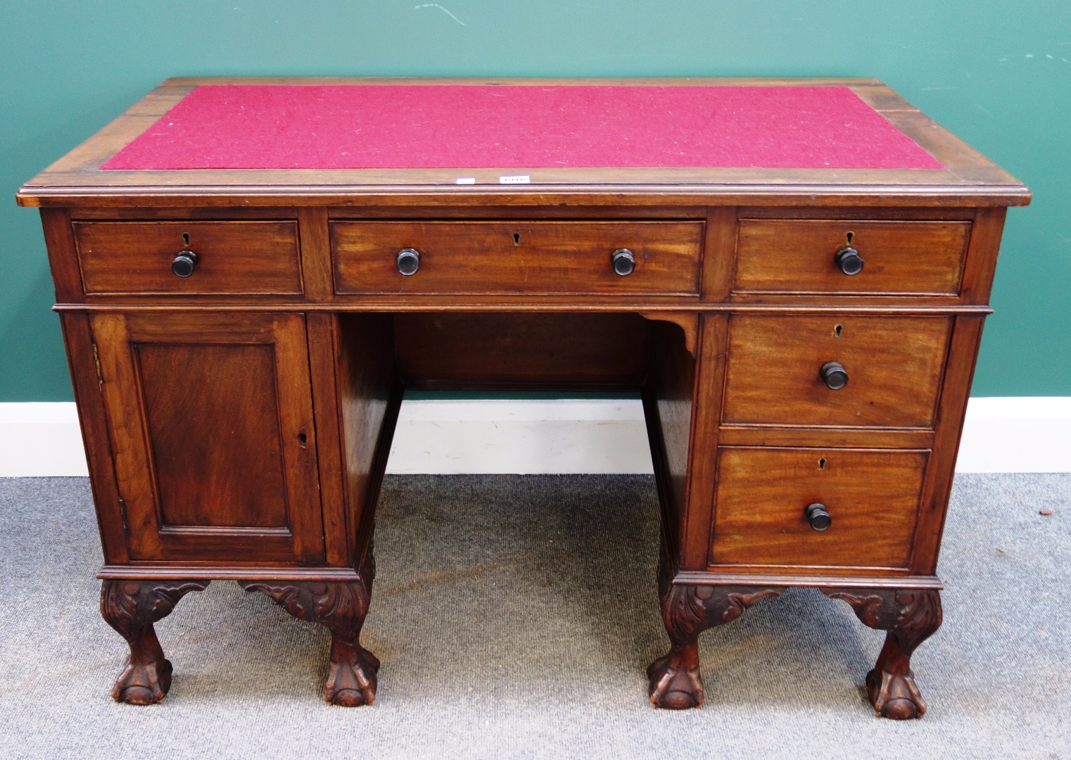 Appraisal: An early th century walnut knee hole writing desk with