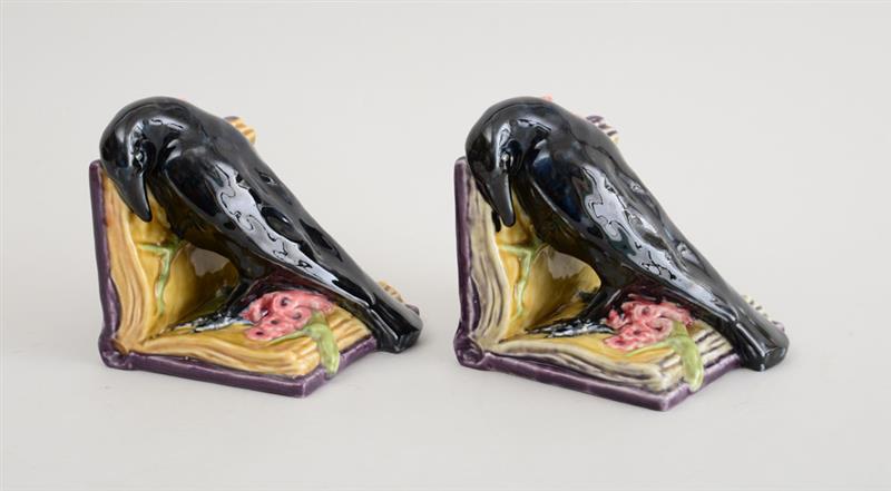 Appraisal: PAIR OF ROOKWOOD GLAZED POTTERY BIRD-FORM BOOKENDS The logo above