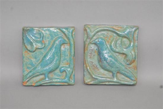 Appraisal: TWO GLAZED ART POTTERY TILES Depicting birds and vines x