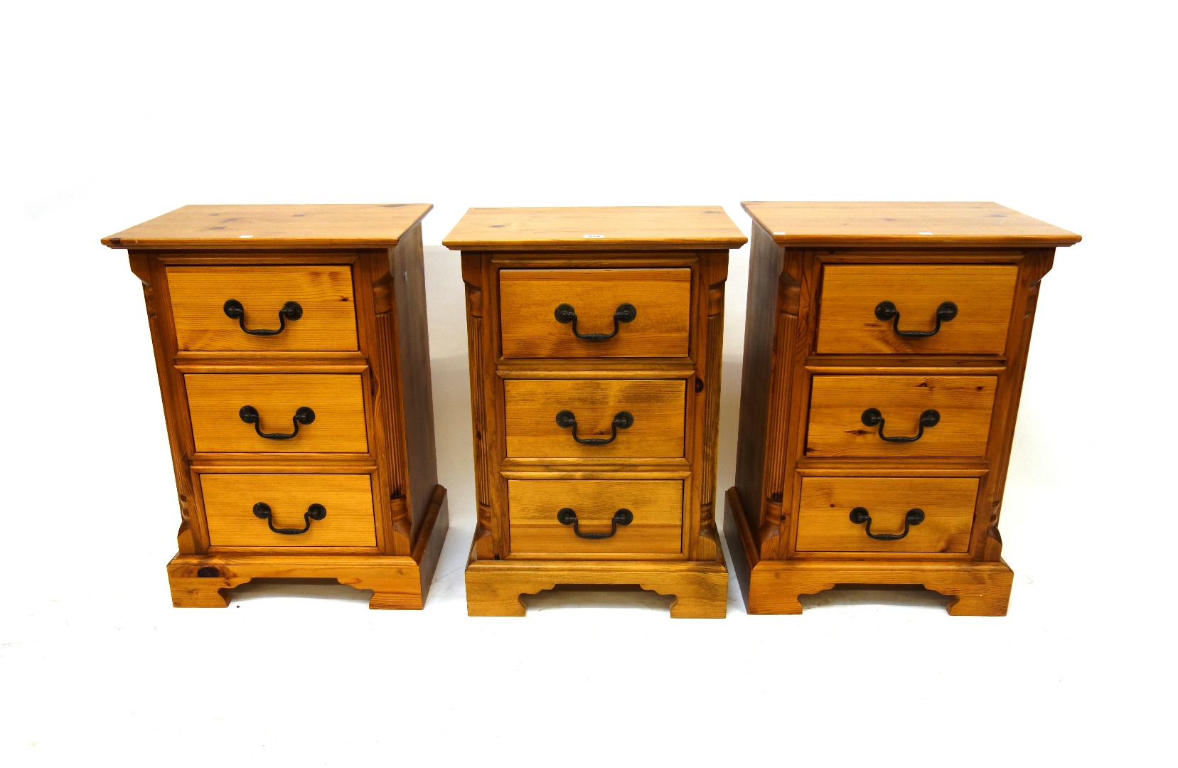 Appraisal: A set of three reproduction 'Georgian' pine bedside chests each