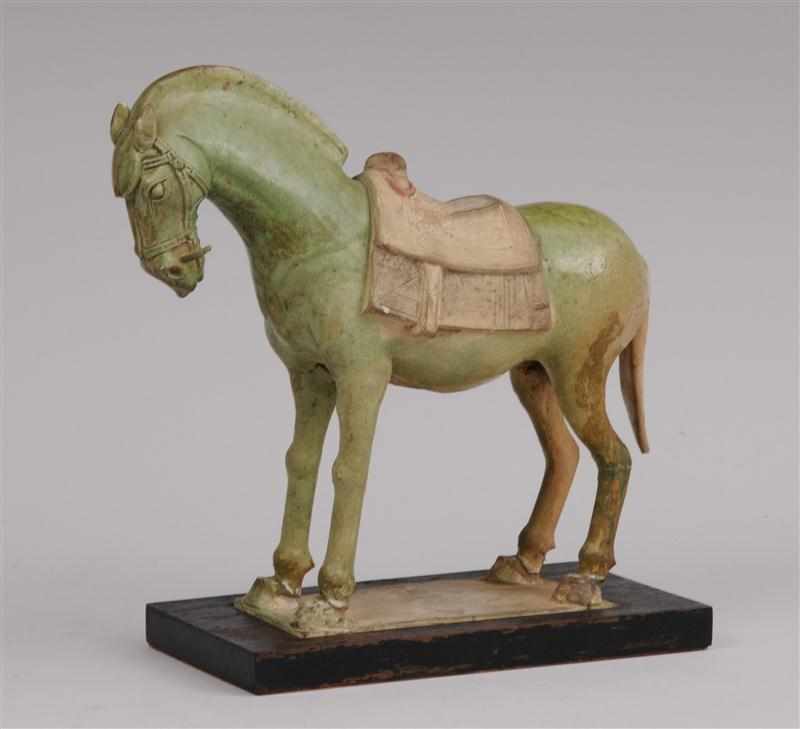 Appraisal: TANG PART-GLAZED POTTERY FIGURE OF A HORSE Standing foursquare with