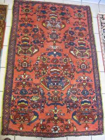 Appraisal: Lilihan Persian Handmade Rug florals objects on red field '