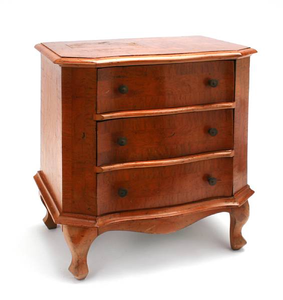 Appraisal: An Italian Rococo style walnut miniature chest height in width