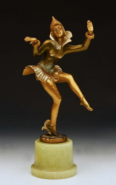 Appraisal: AN ART DECO STYLE GOLD LACQUERED METAL FIGURE of a