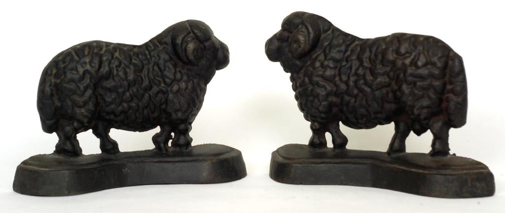 Appraisal: PAIR OF CAST IRON SHEEP AND RAM CHIMNEY ORNAMENTS each