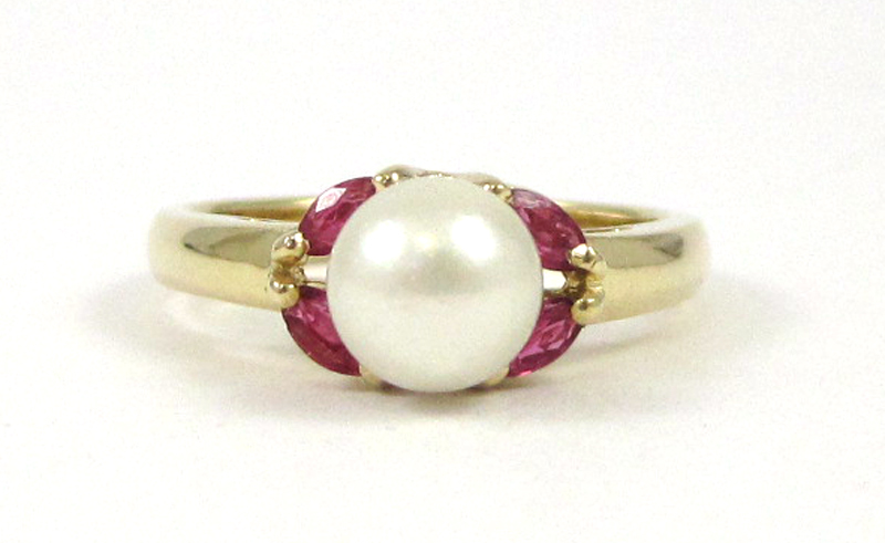 Appraisal: RUBY PEARL AND FOURTEEN KARAT GOLD RING with four marquise-cut