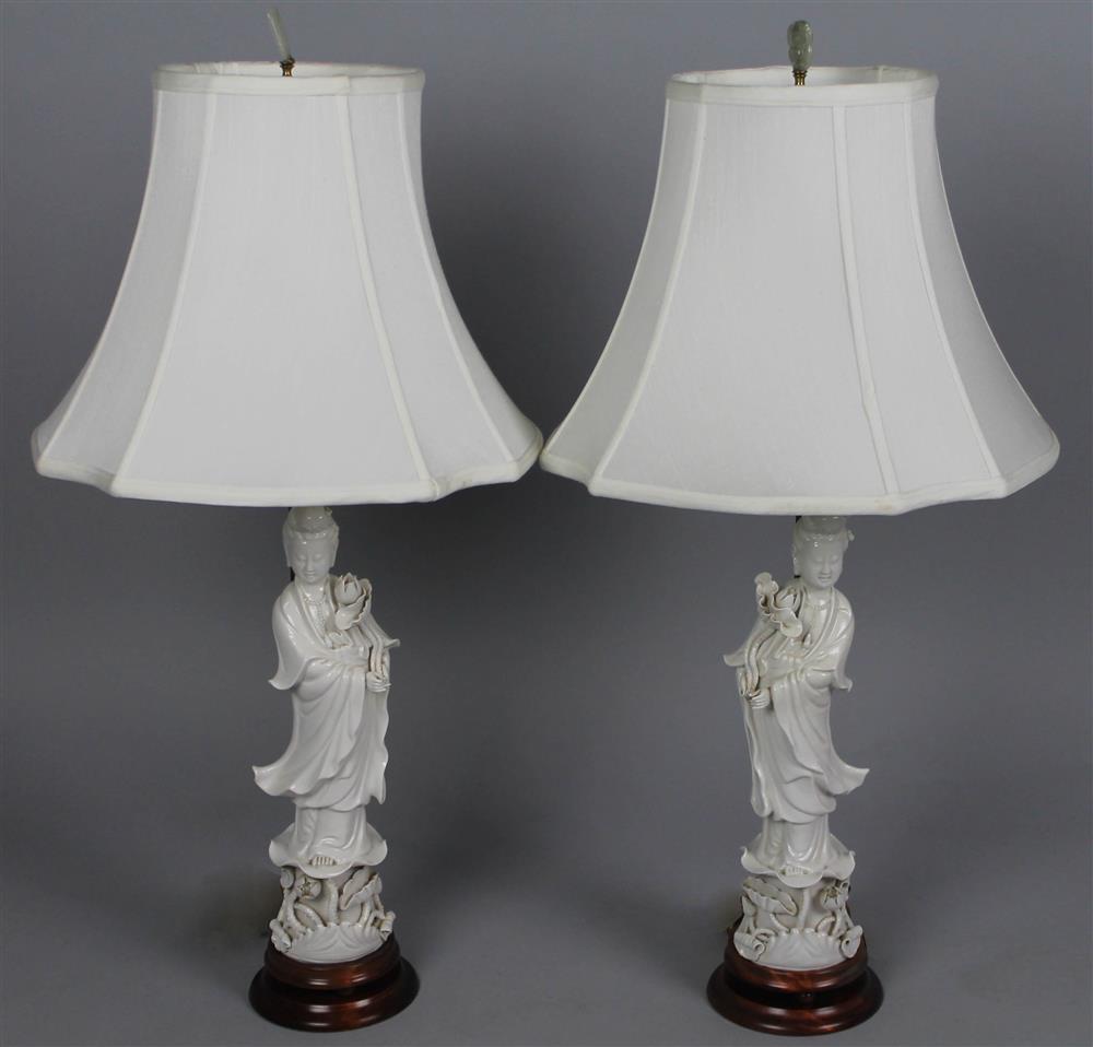 Appraisal: PAIR OF CHINESE BLANC-DE-CHINE-MOUNTED TABLE LAMPS the cast figures holding