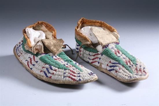 Appraisal: PAIR SIOUX BEADED BUCKSKIN MOCCASINS Circa Fully beaded hard-soled moccasins