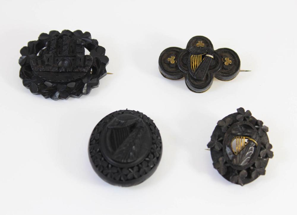 Appraisal: FOUR ARTICLES OF VICTORIAN CARVED BOG OAK JEWELRY Ireland th