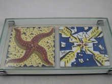 Appraisal: Two ceramic tiles by Salvador Dali each signed by the