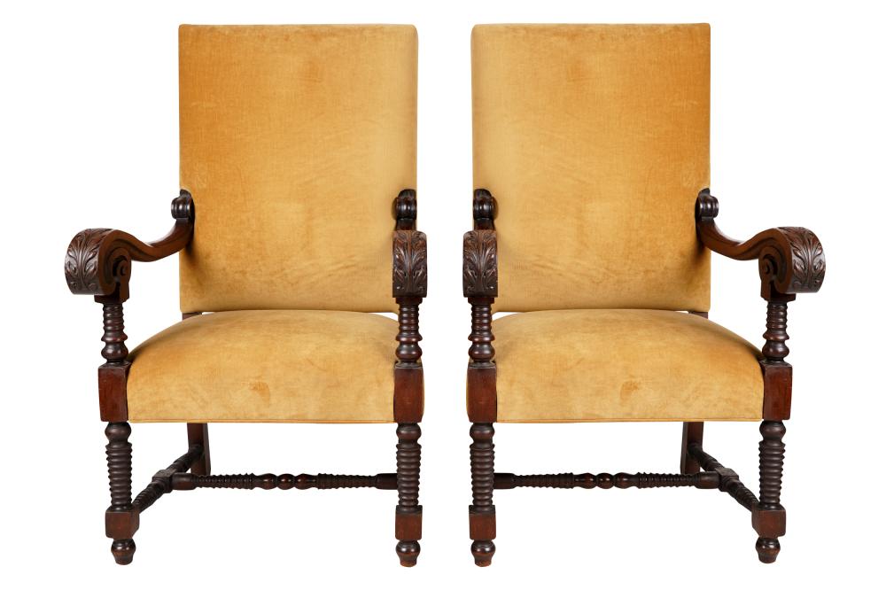 Appraisal: PAIR OF SPANISH BAROQUE-STYLE ARMCHAIRScarved walnut covered with yellow velvet