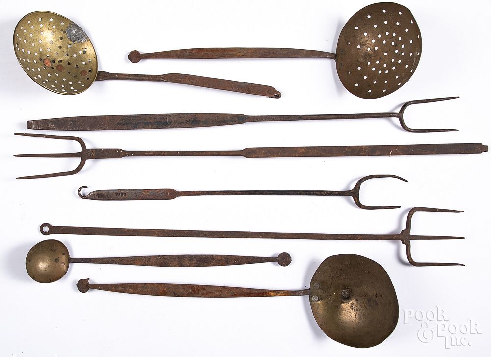 Appraisal: Wrought iron and brass utensils Wrought iron and brass utensils