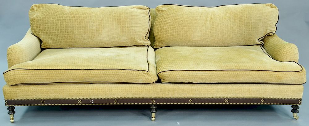 Appraisal: Upholstered sofa with leather trim lg in Upholstered sofa with