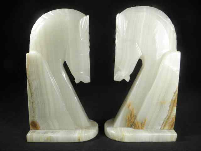 Appraisal: Pair of carved Alabaster horse head form book ends Two